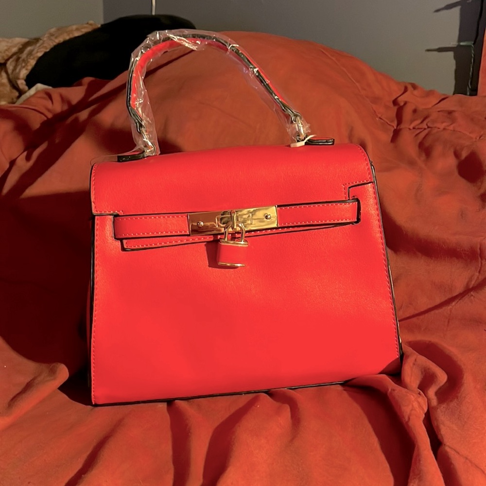 Hot Pink Small handheld purse.